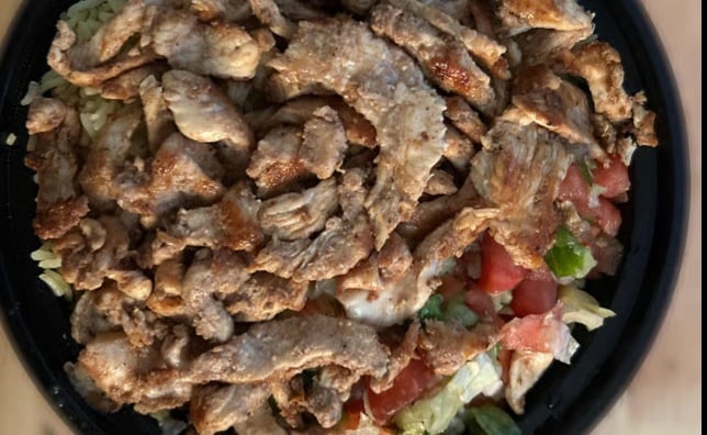Chicken Shawarma Platter with pickles, garlic sauce, hummus, salad and pita bread
