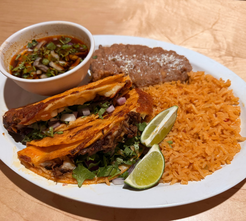 Birria tacos and consommé spread at Casa de la Birria Spokane