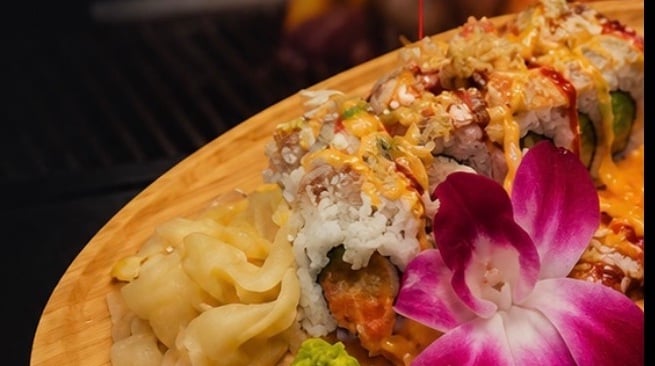 Peachtree Island Roll with tempura shrimp, crab salad and eel sauce