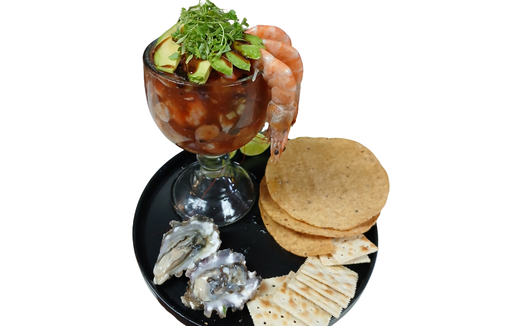 Coctel de Camaron shrimp cocktail in tomato lime broth with avocado