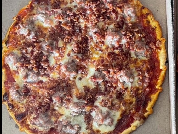 Meatlovers pizza with sausage, pepperoni, bacon and Canadian bacon