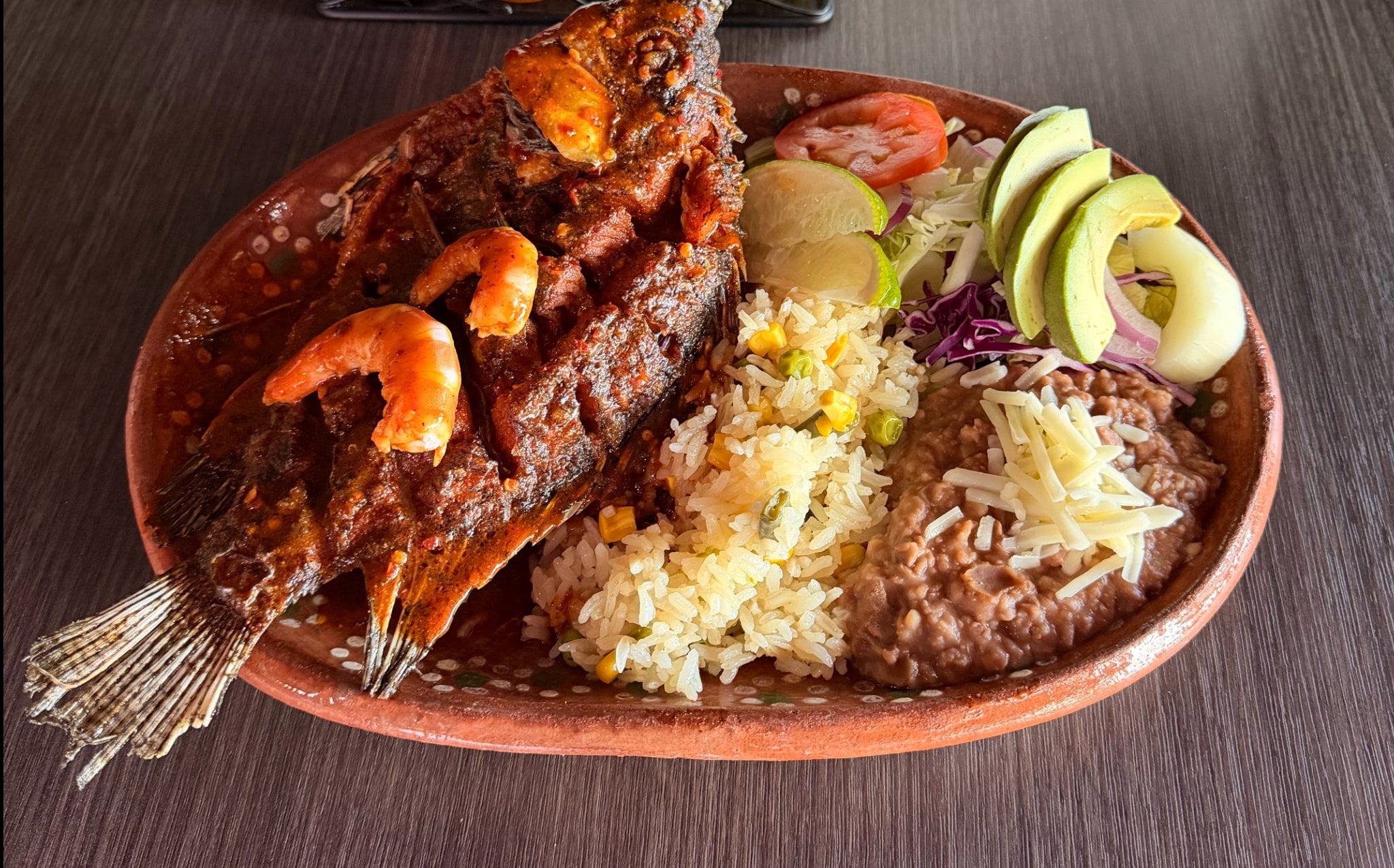 Mojarra Regular - whole golden fried fish with rice beans and avocado salad