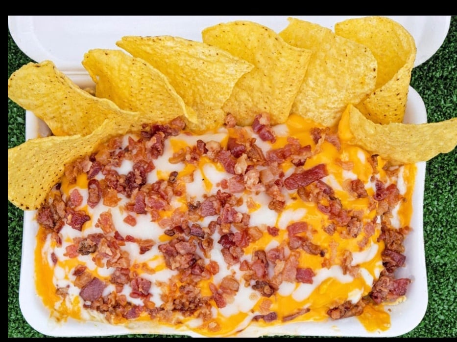 Batata Bori with shredded chicken, pernil, bacon and two cheeses
