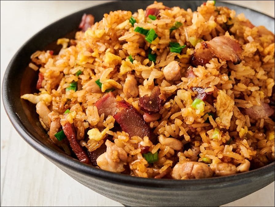 BBQ spare ribs glazed with savory barbecue sauce and fried rice