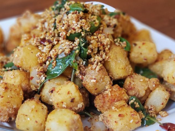 Szechuan dish with vibrant red chili peppers and aromatic spices at Spices 3