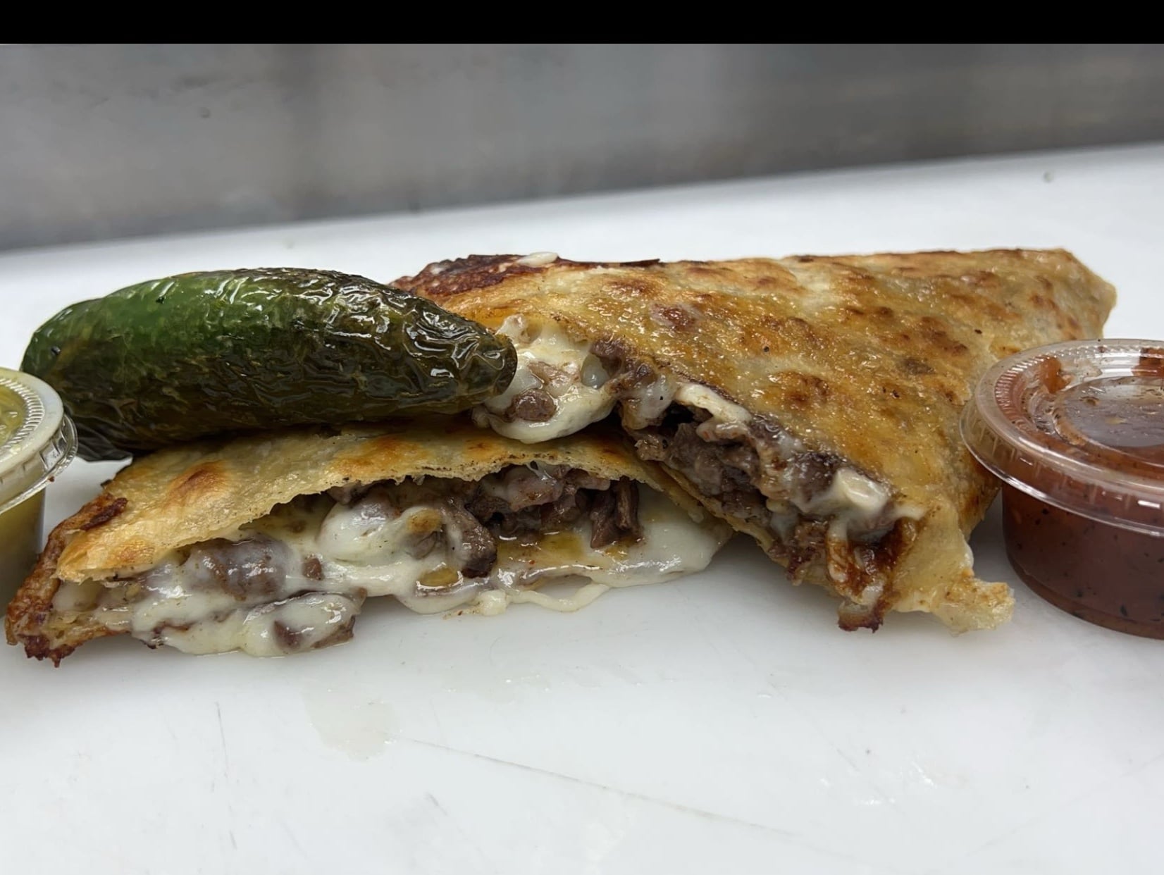Mexican quesadilla with melted cheese and meat