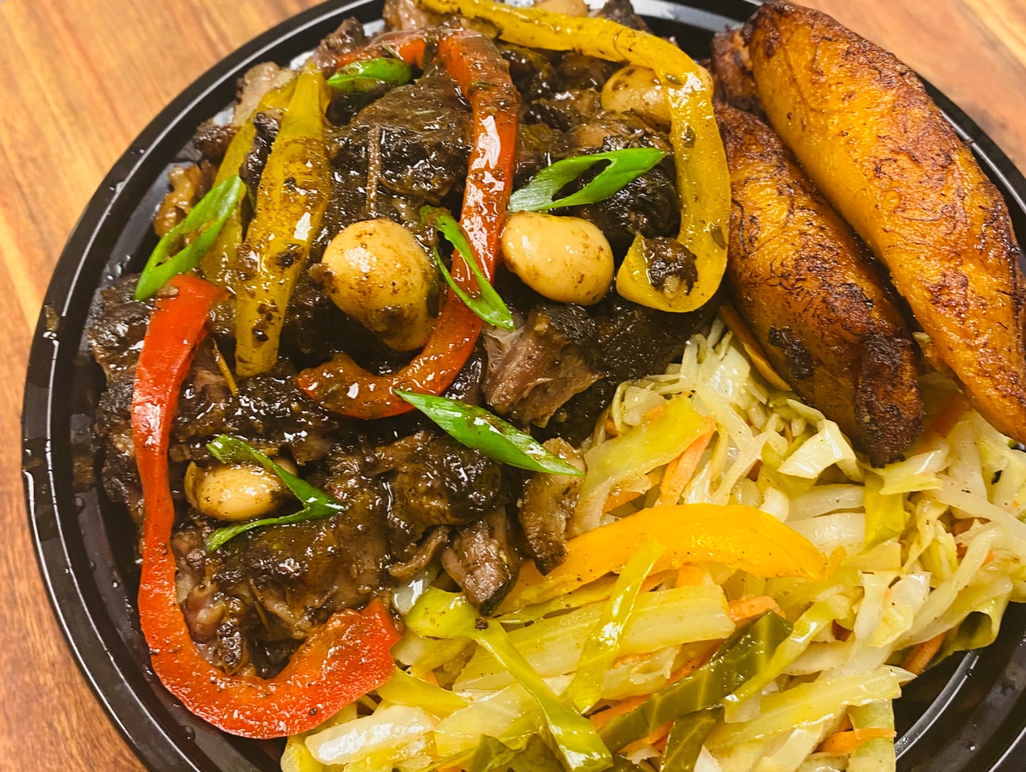 Bone in Ox Tail Bowl served with rice and plantains