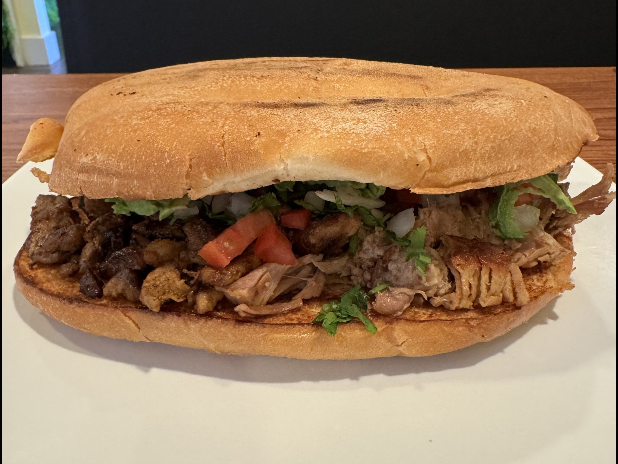 El Chavo Torta on telera bread with turkey ham, lettuce, tomato and jalapeños