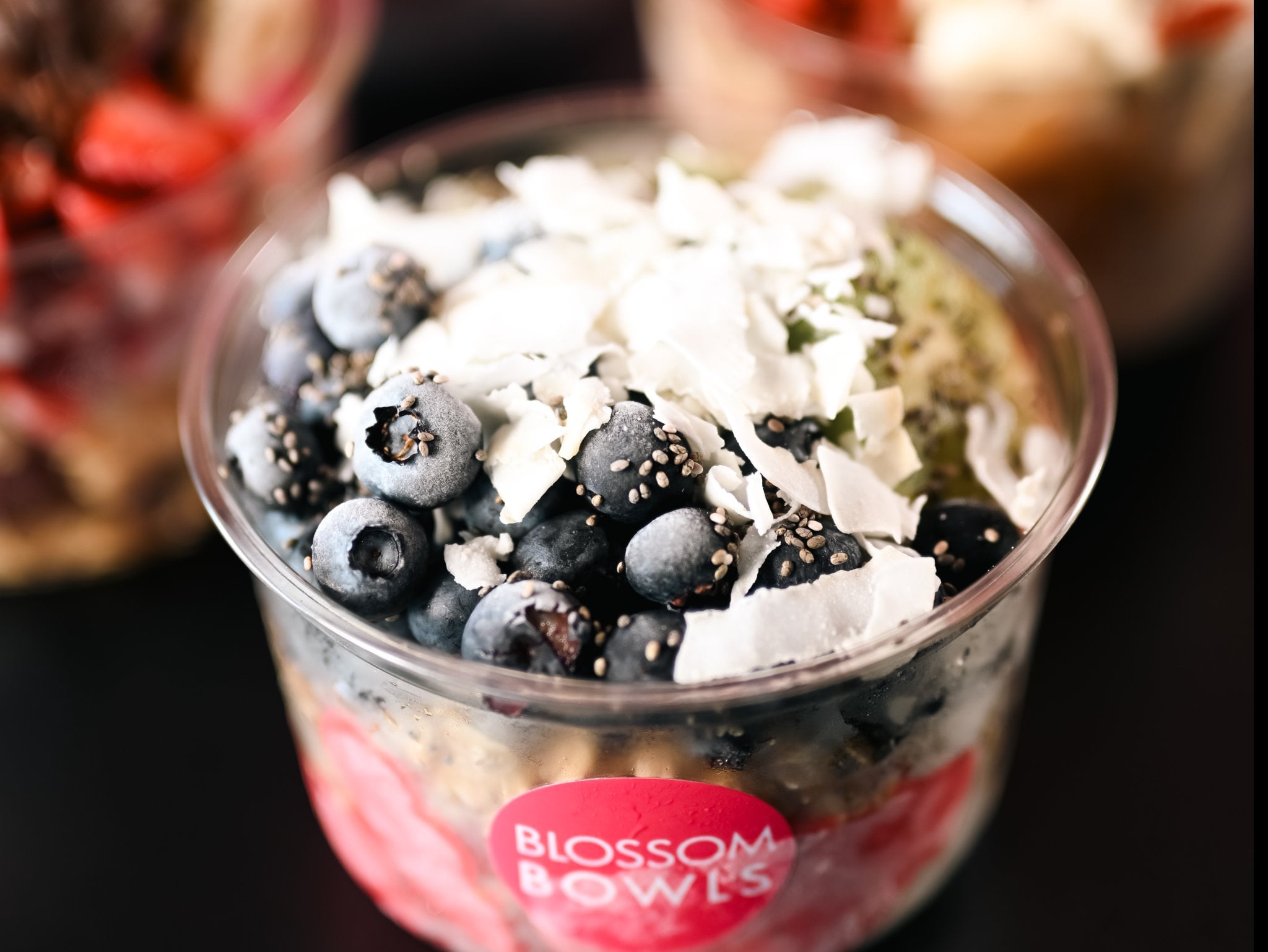 Blossom Bowls acai bowl topped with banana, strawberry, granola and honey