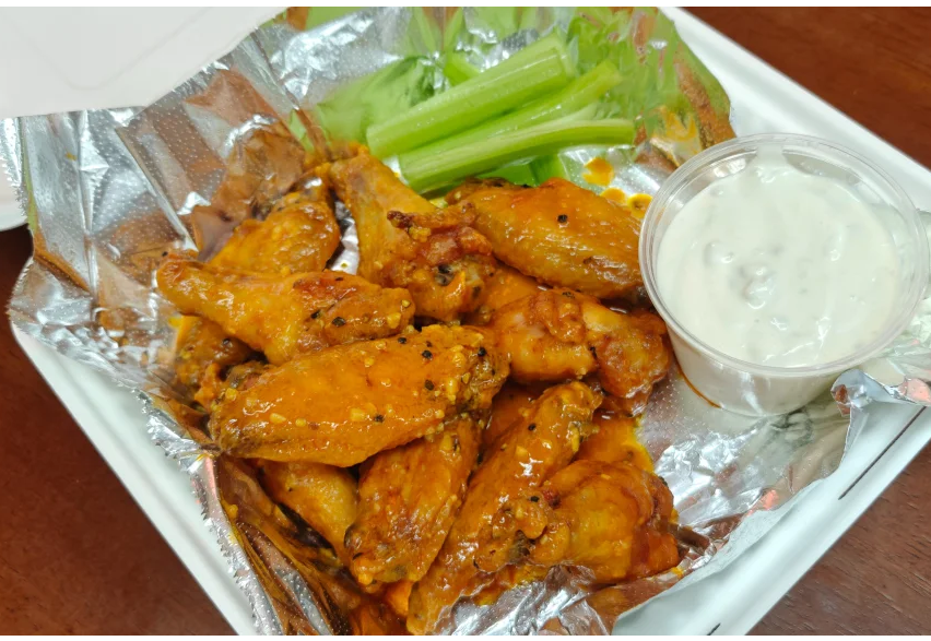One dozen crispy chicken wings tossed in sauce
