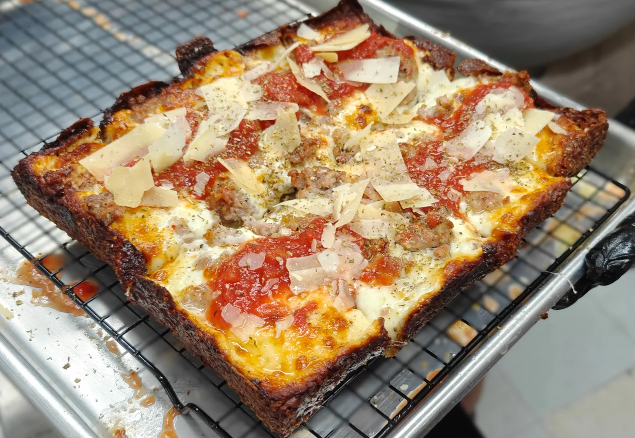 Ye Ol' Fashioned sourdough pizza with cheese, sausage and red sauce