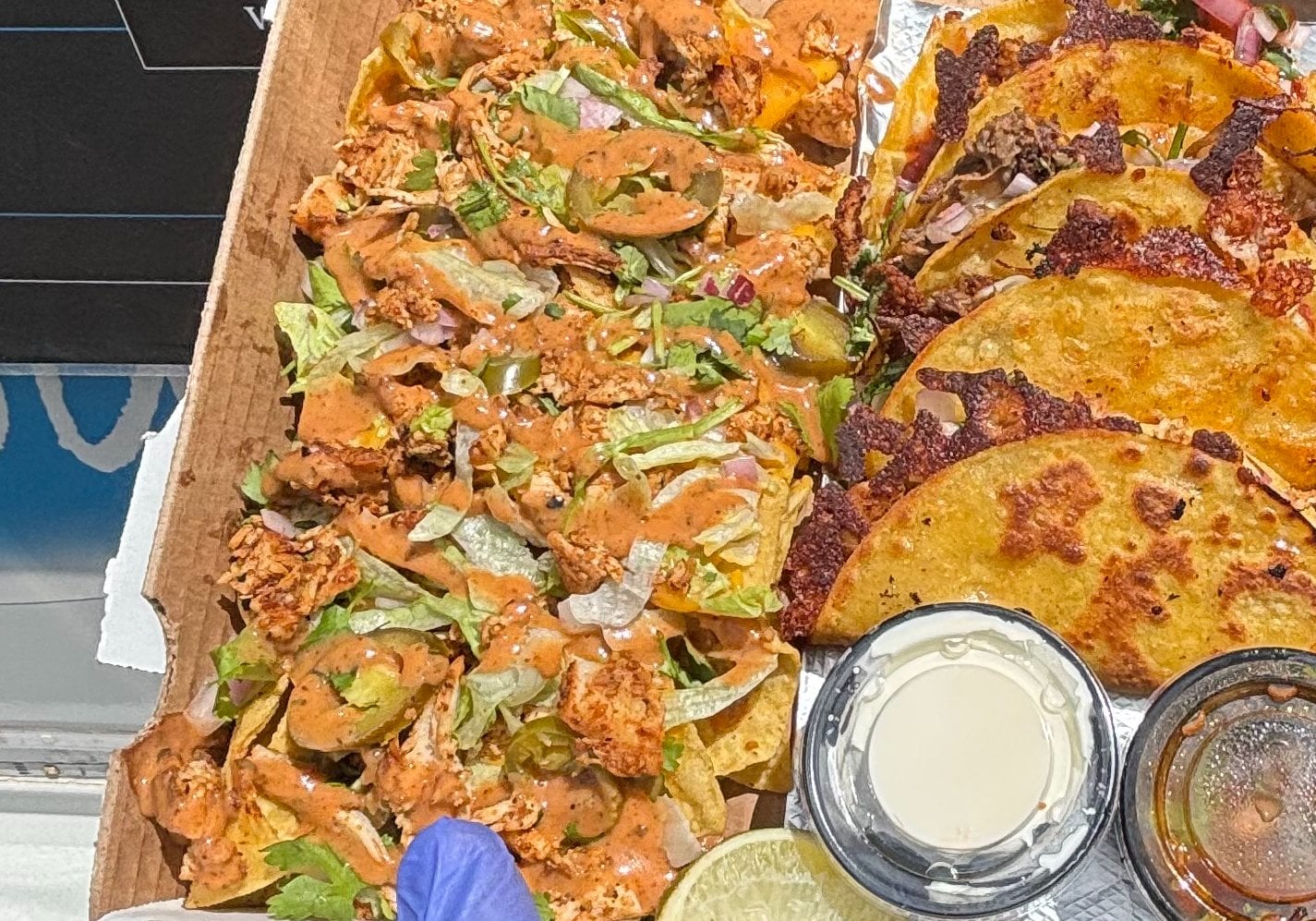 Loaded nachos topped with queso, jalapenos and special sauce