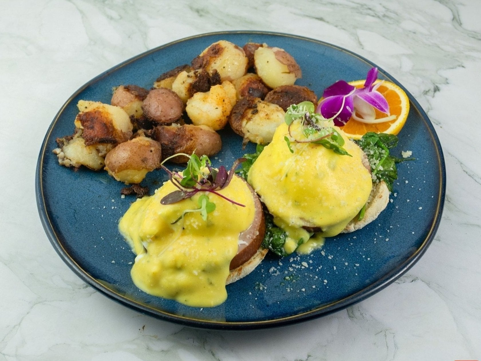 Country Benedict with sausage patty and buttermilk biscuit