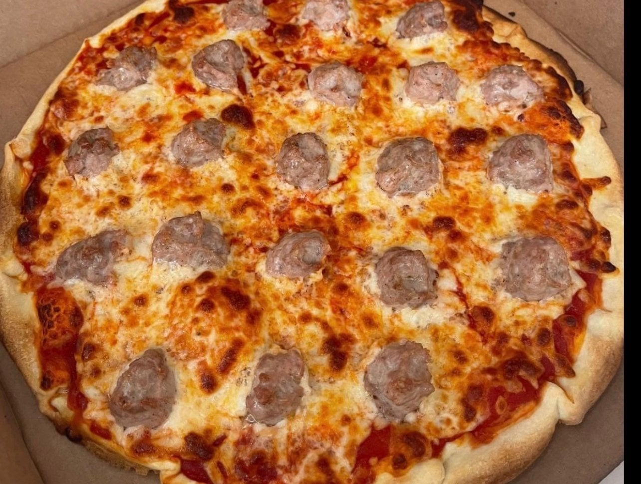 Build Your Own Pizza with sausage, green peppers and jalapeños