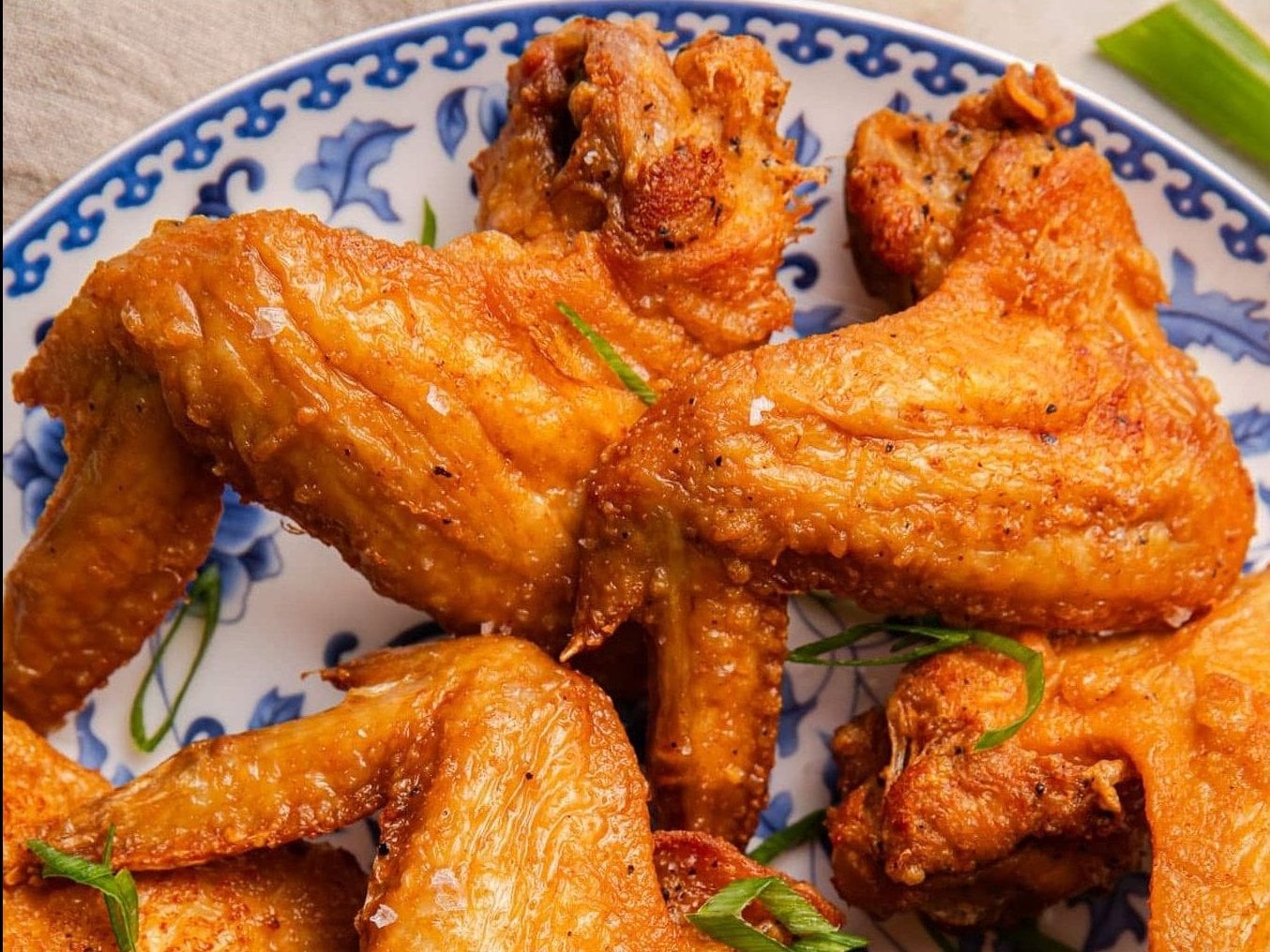 Crispy fried chicken wings with savory fried rice