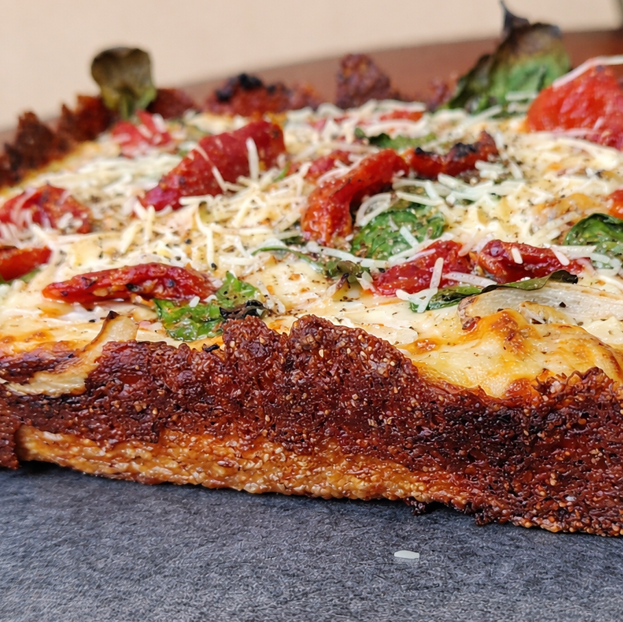 Ye Ol' Fashioned Detroit-style pizza with crispy cheese edges and red sauce stripes