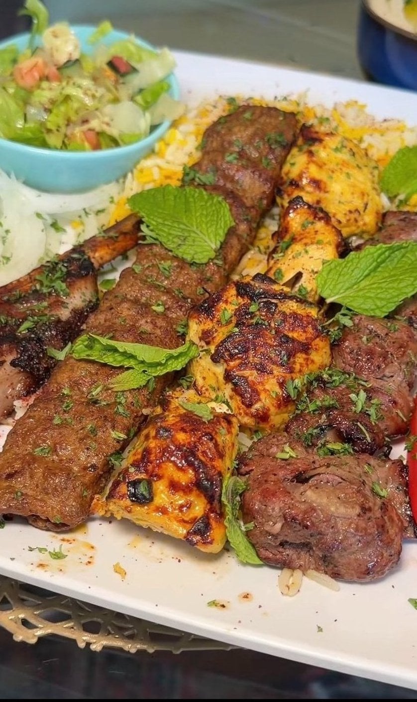 Grilled kabob plate with rice and salad