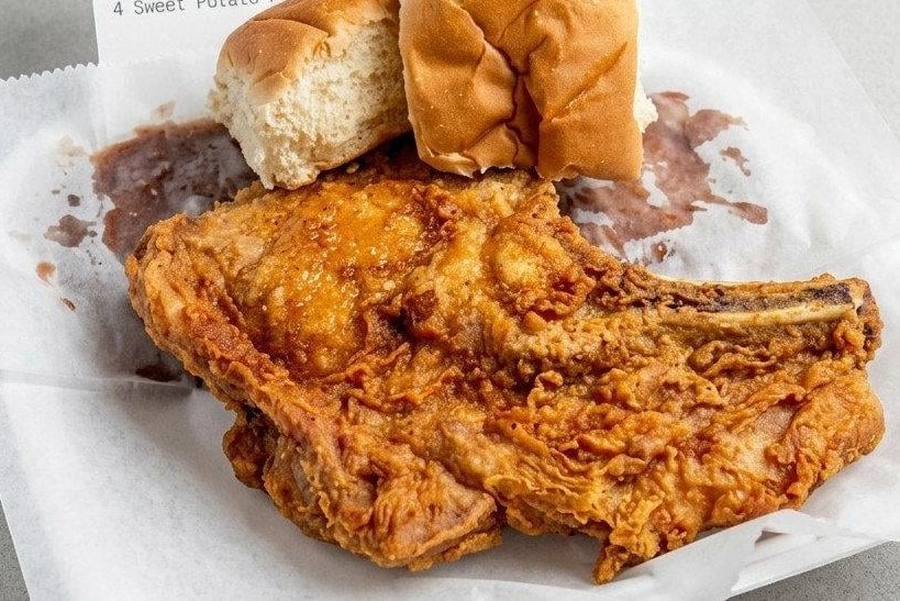 Fried chicken dinner with two sides and a roll